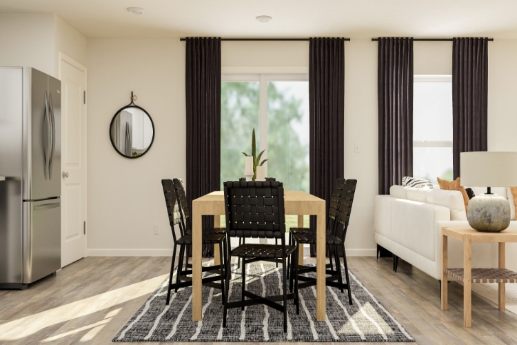 A dining room with a couch and a table.