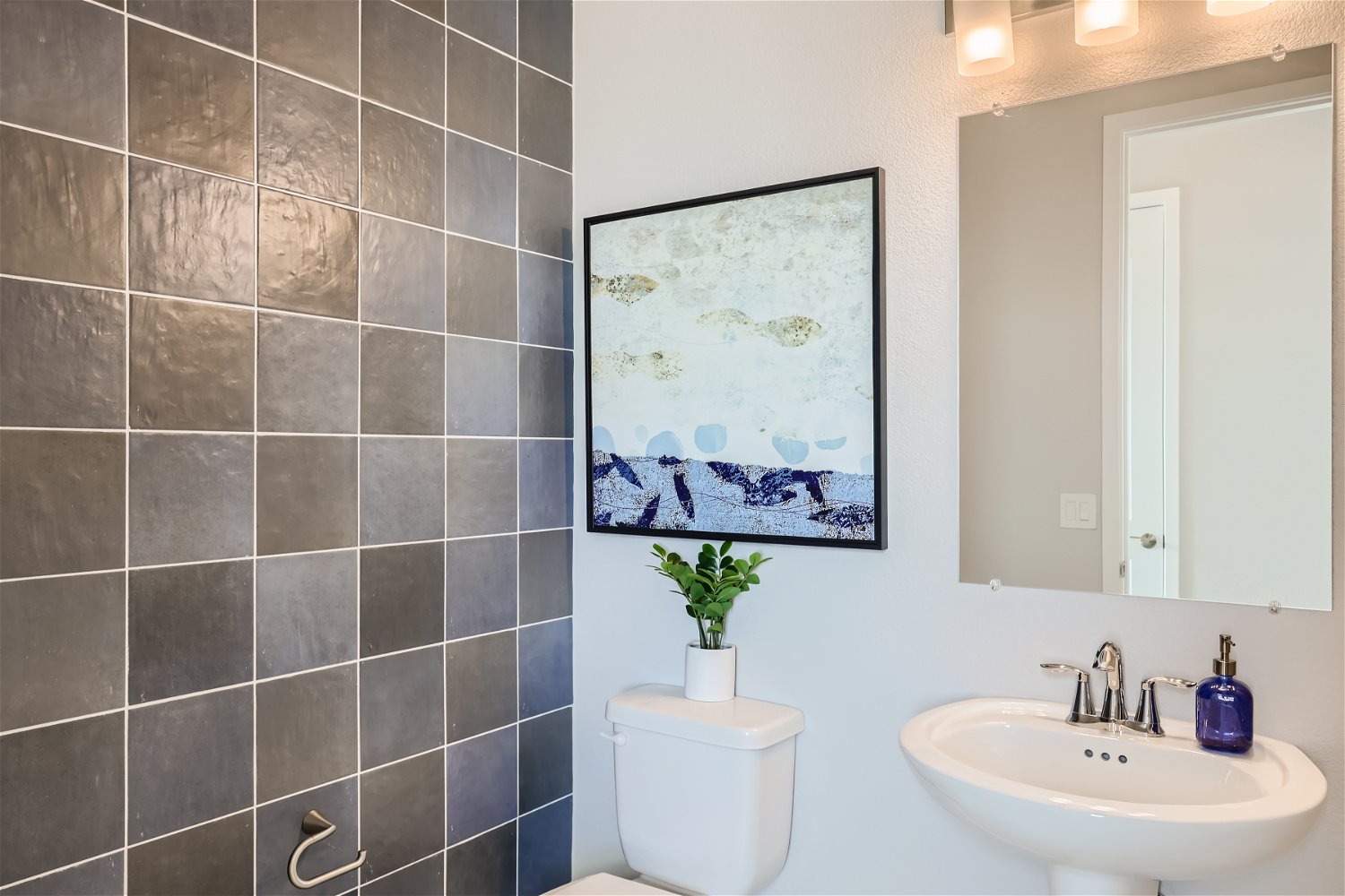 A bathroom with a sink and a toilet.