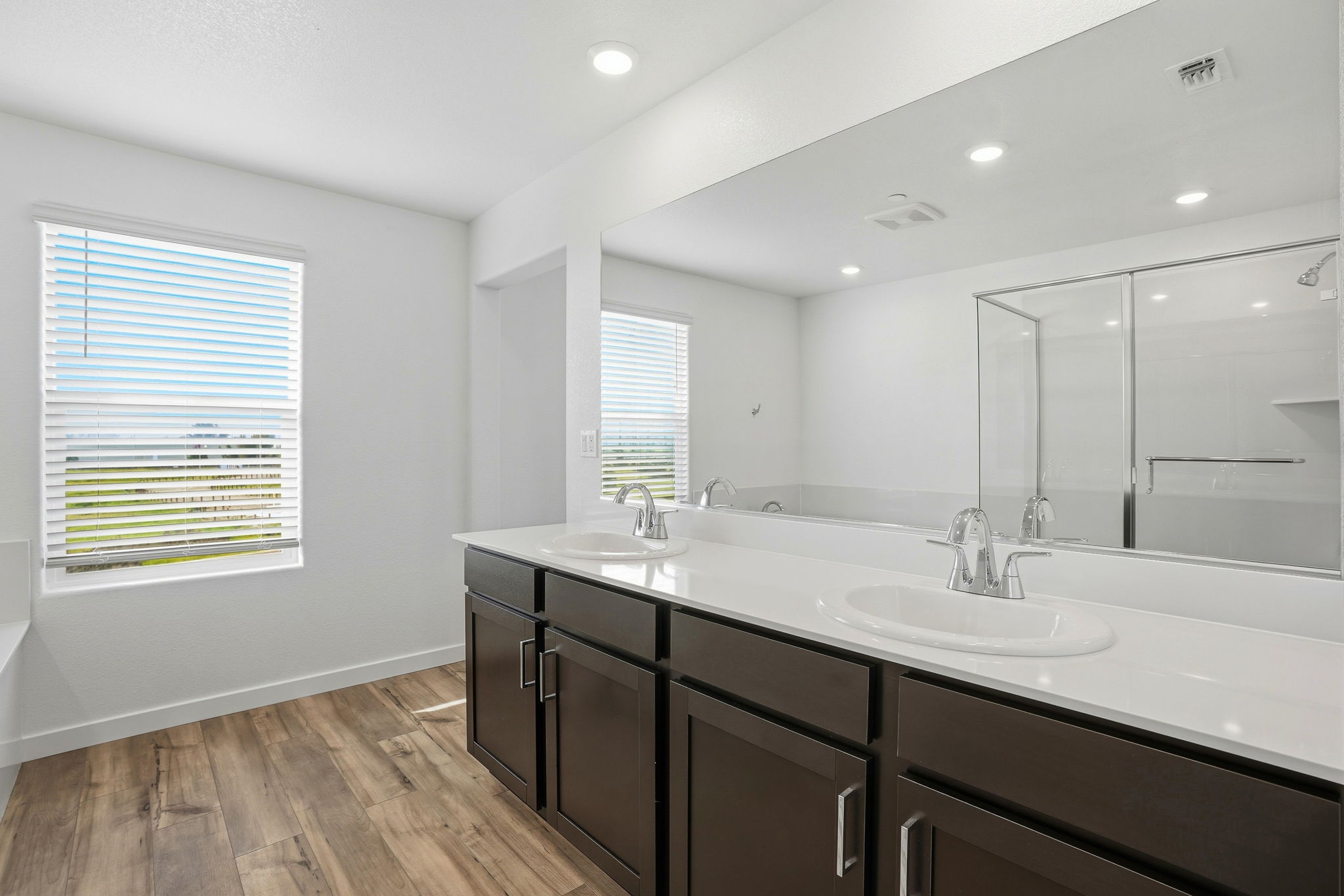 A bathroom with a large mirror.