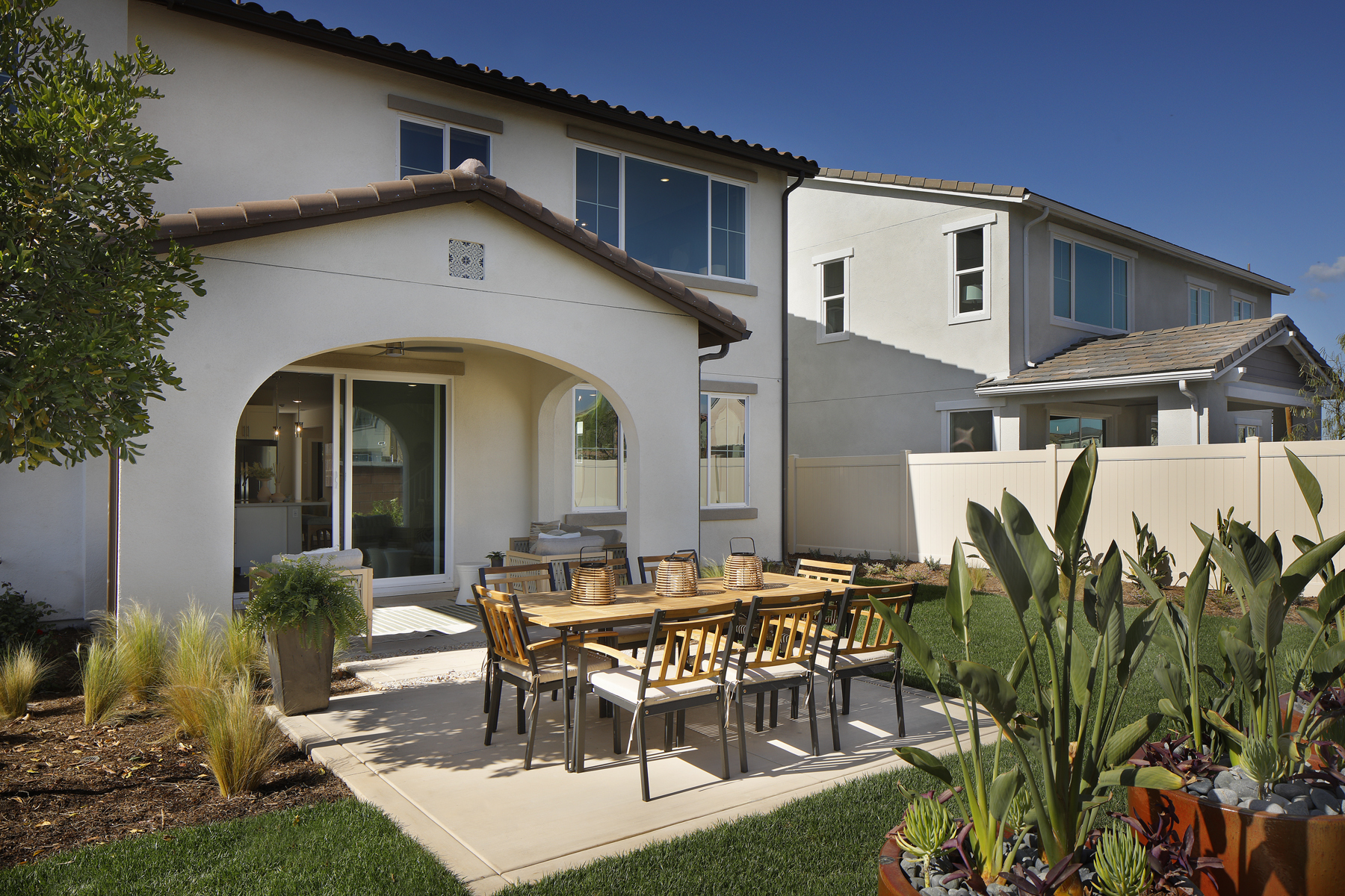 A patio with a table and chairs.