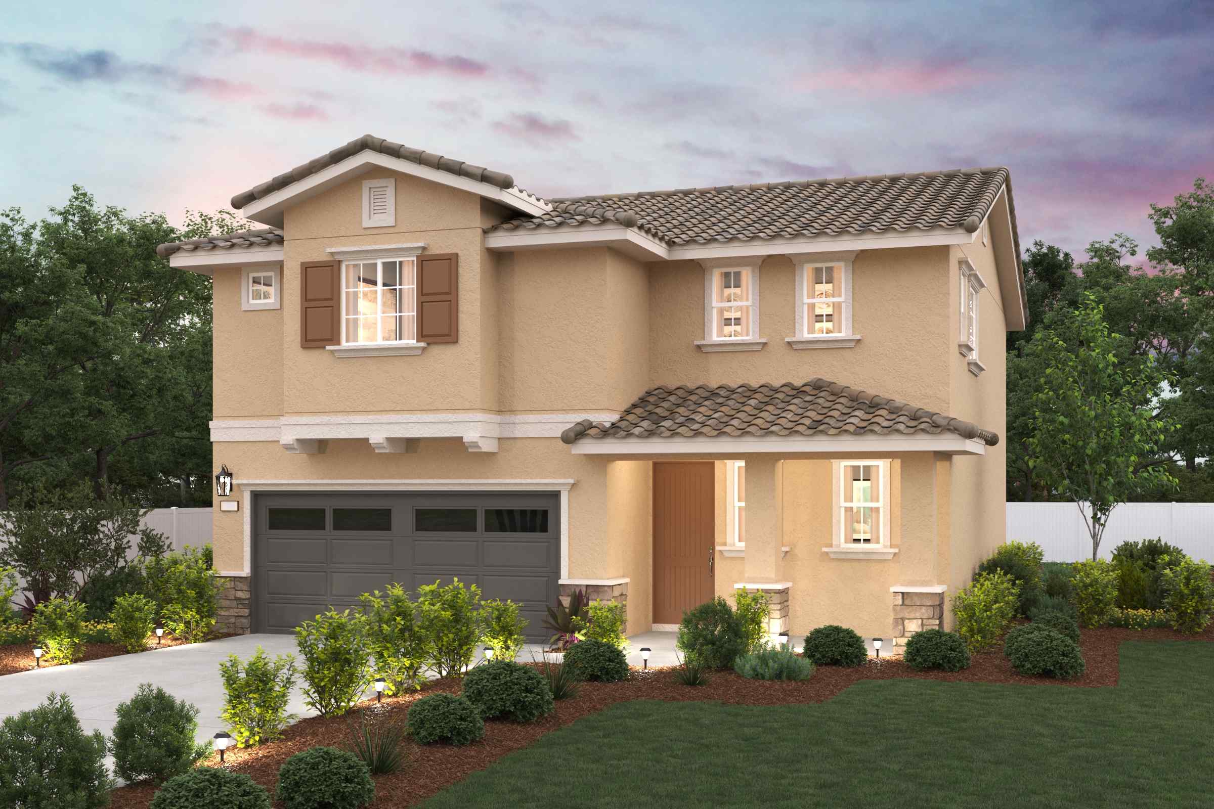 A house with a garage and trees.