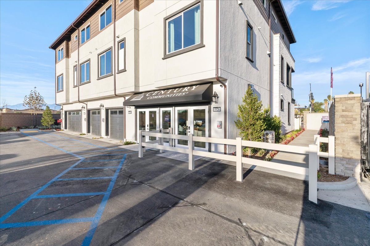 A building with a white fence.
