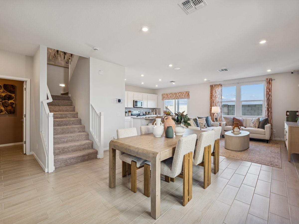 A large kitchen with a dining table.