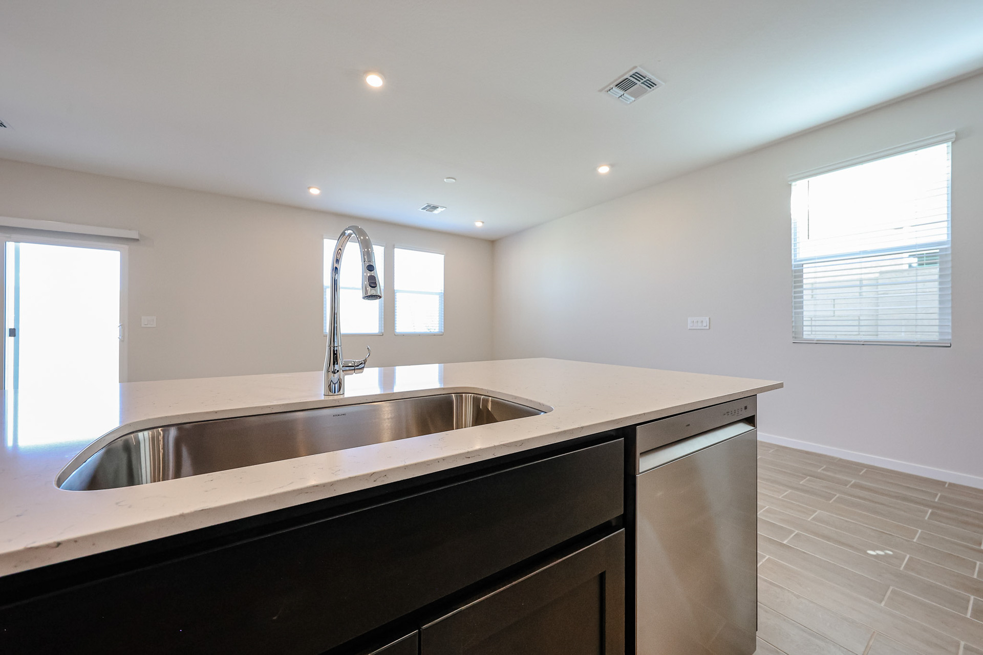 A kitchen with a sink and a window.