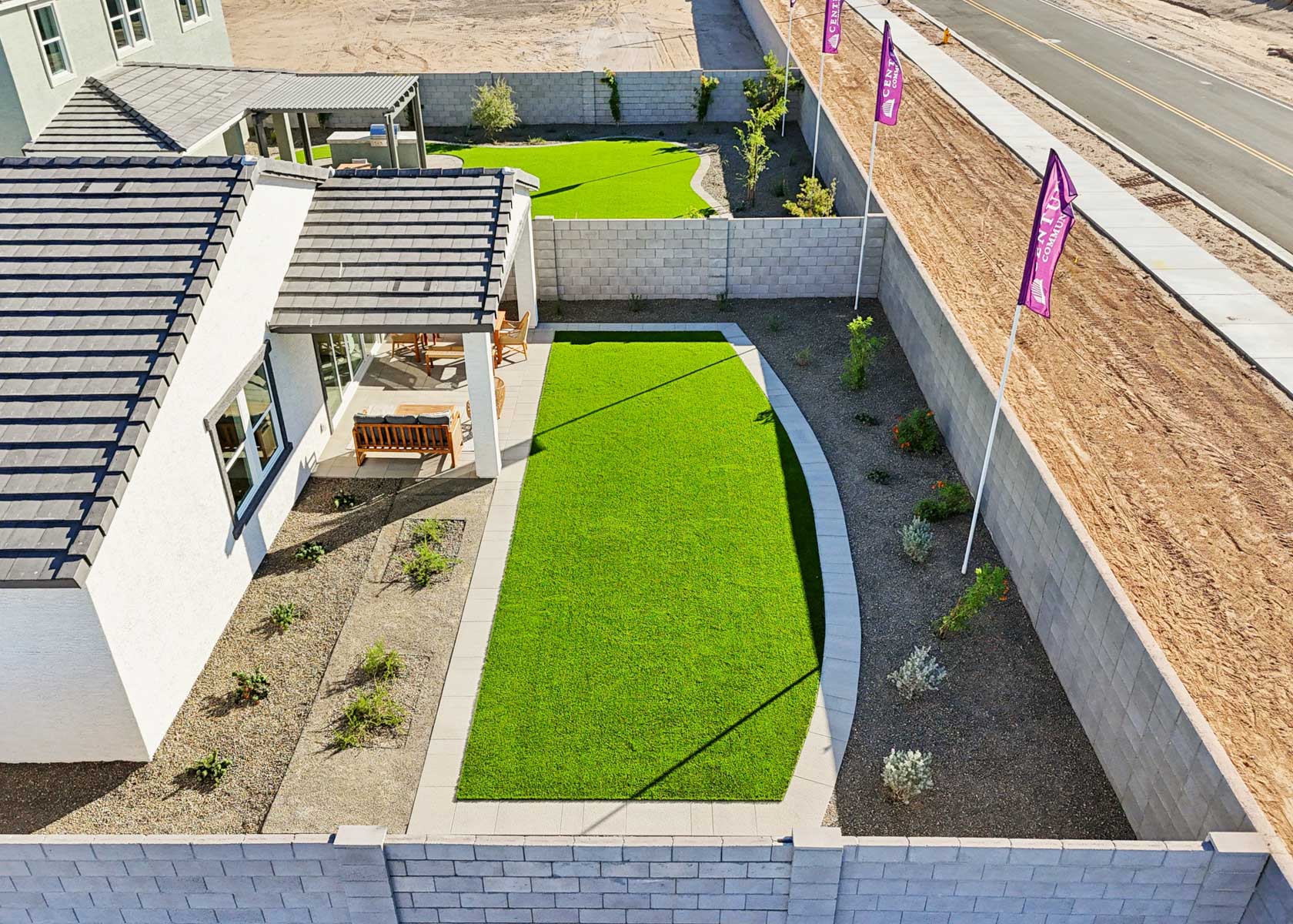 A backyard with a small pond.