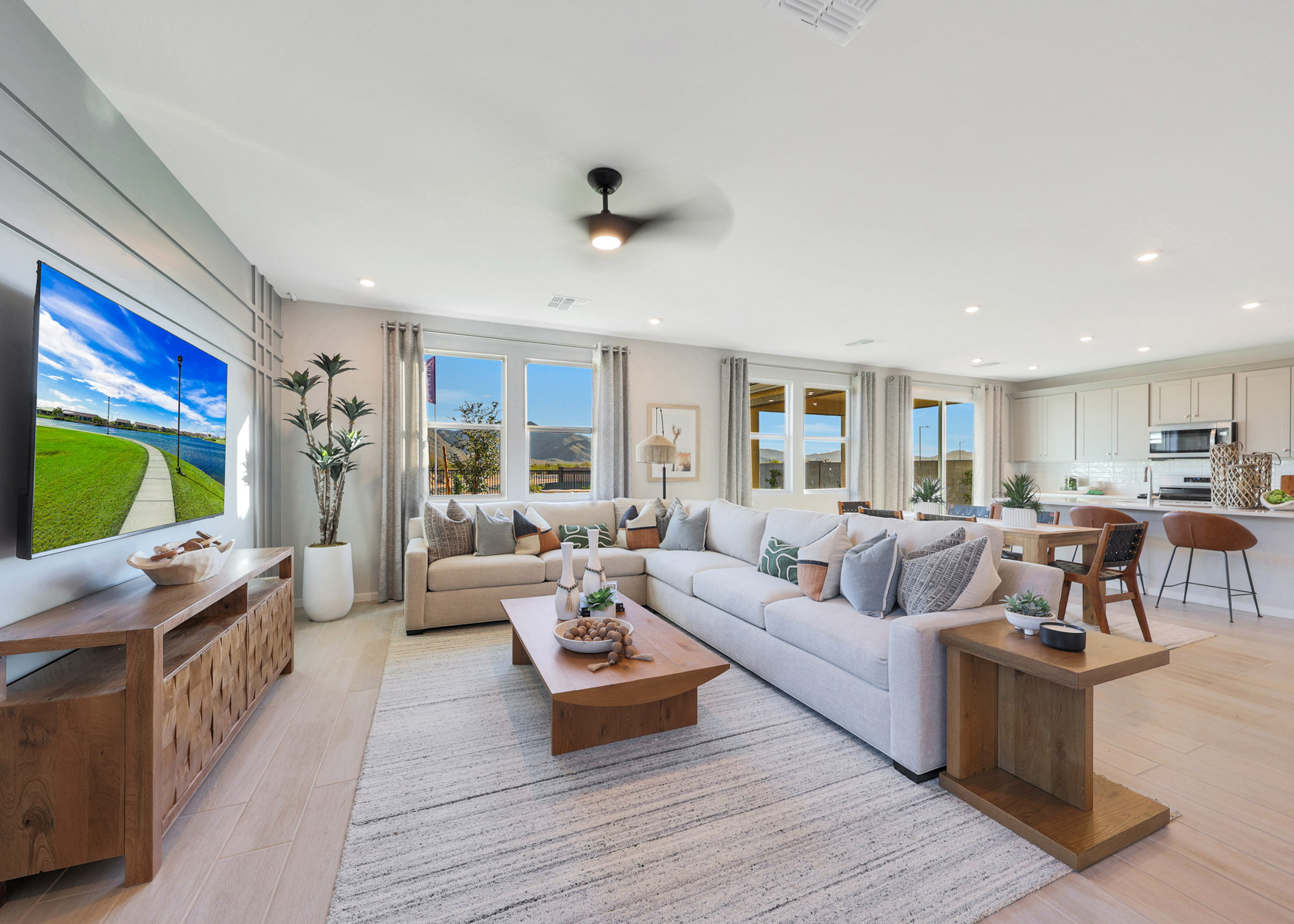 A living room with a large television.