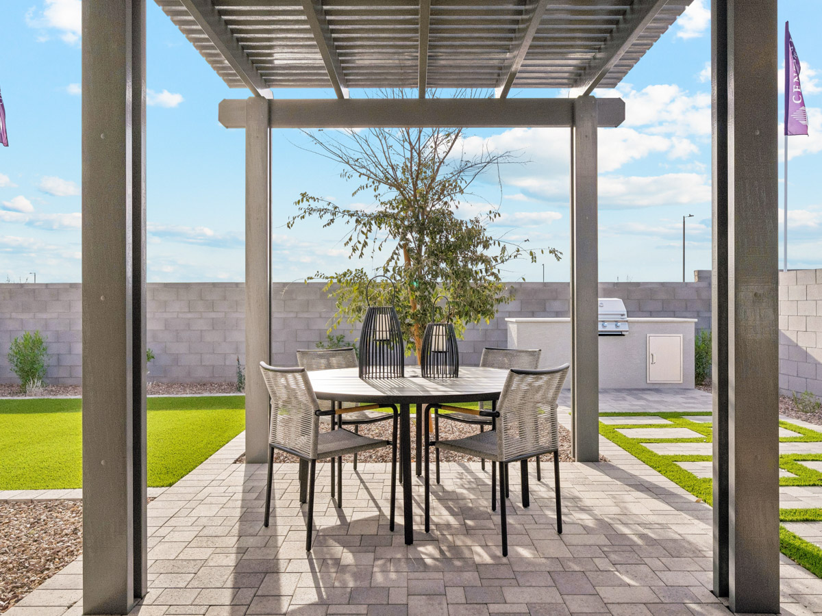 A table and chairs on a patio.