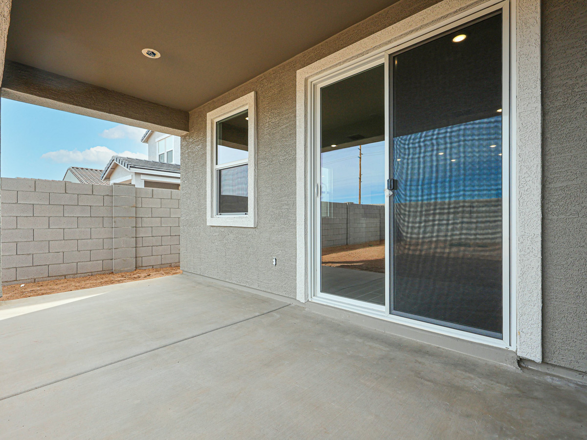 A room with a glass door and a window.