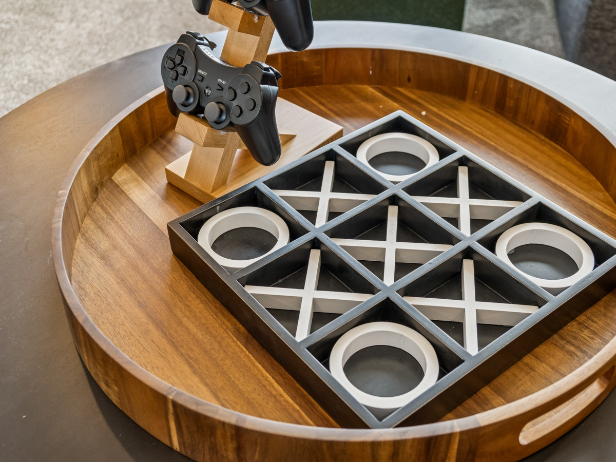 A wood table with a metal object on top of it.