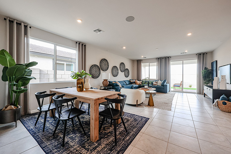 A living room with a table and chairs.