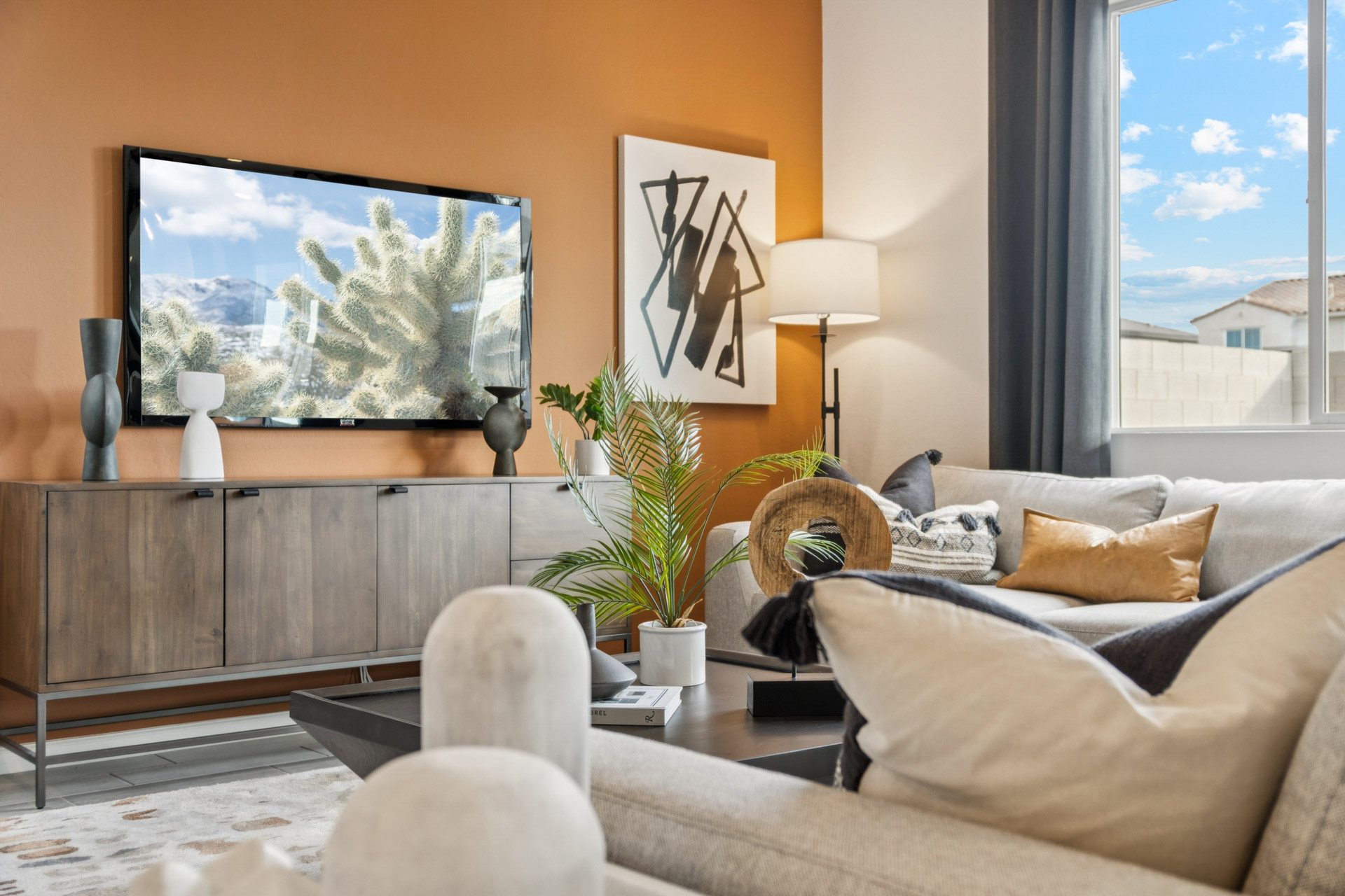 A living room with a large window.