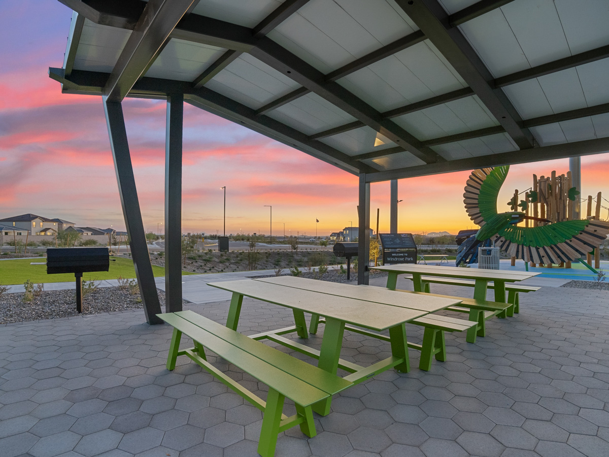 A picnic table under a covered area.