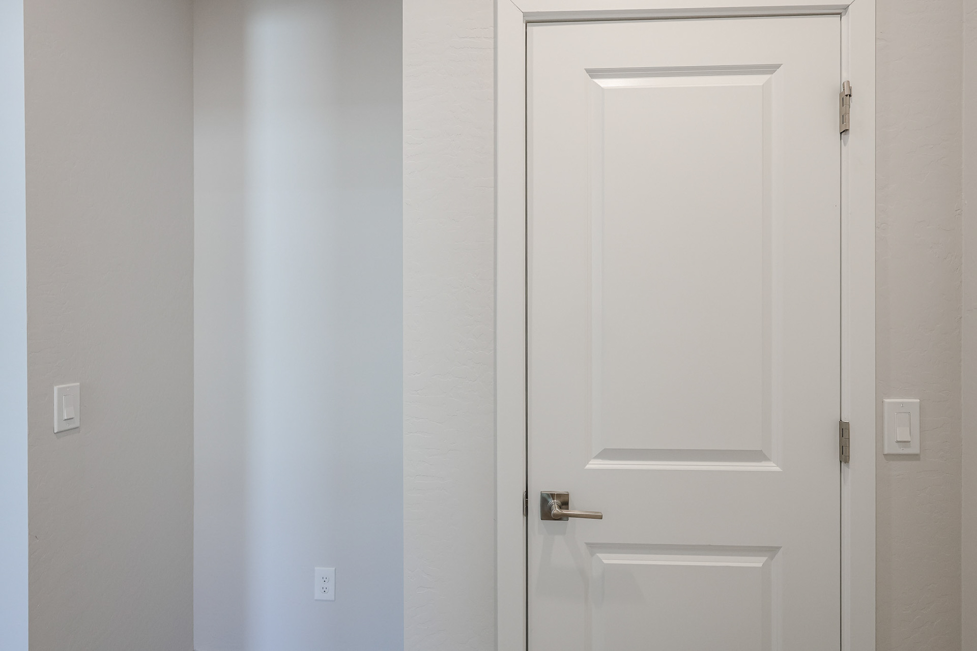 A white door with a handle.