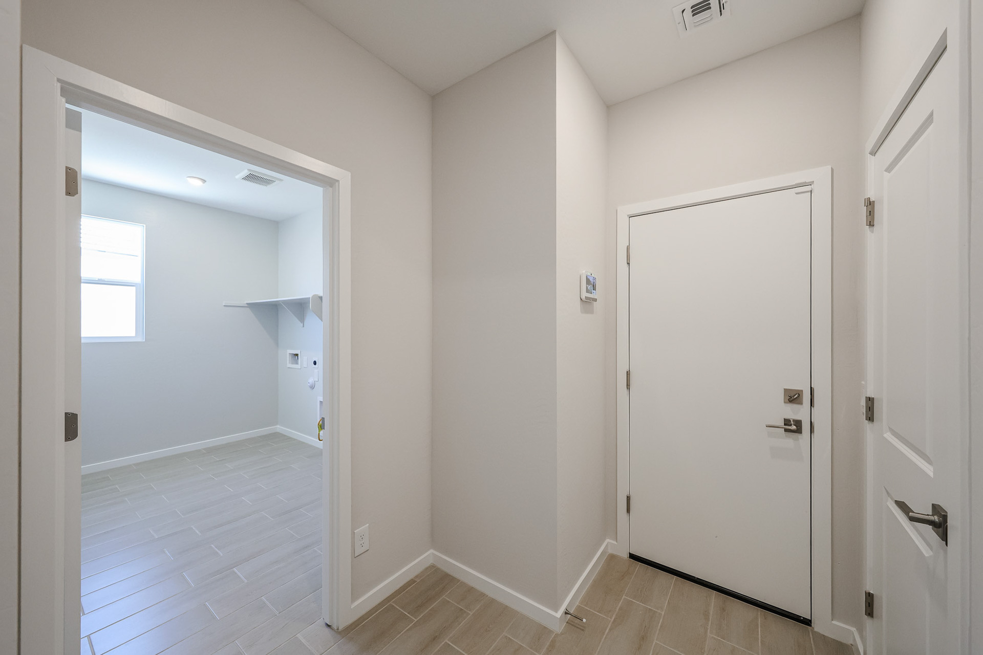 A hallway with white doors.