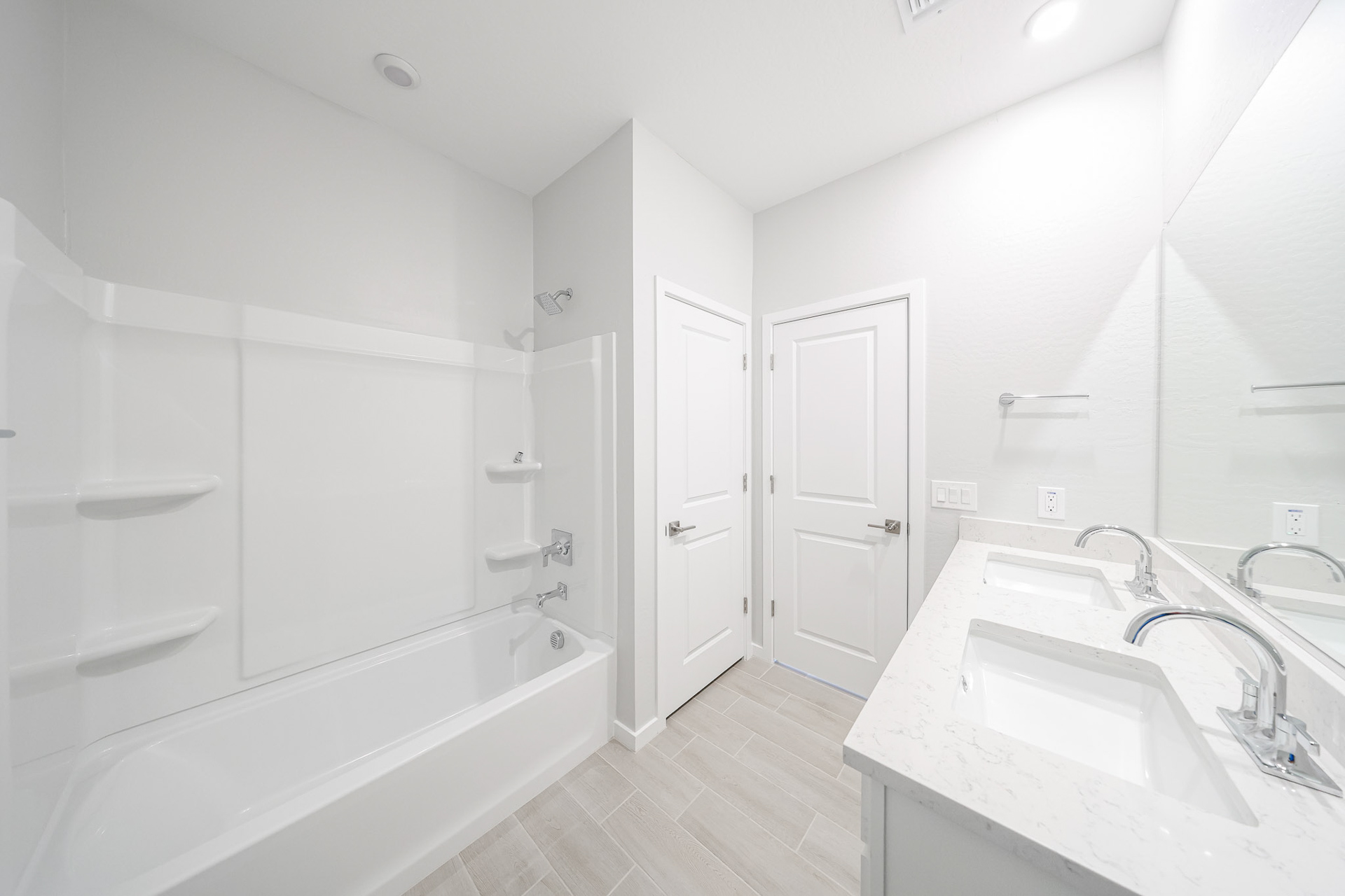 A bathroom with white walls.