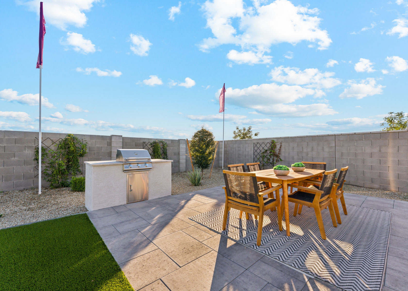 A patio with a table and chairs.