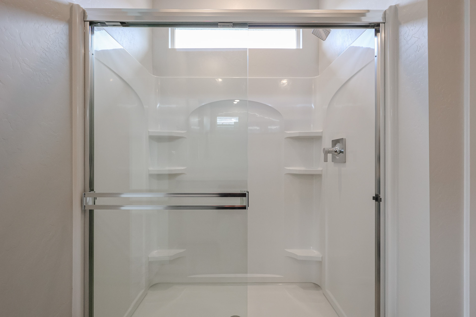 A shower with glass doors.