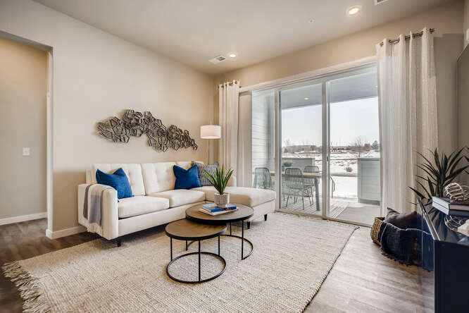 A living room with a large glass door.