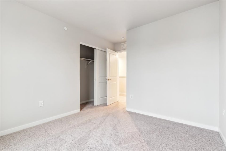 A hallway with white walls.