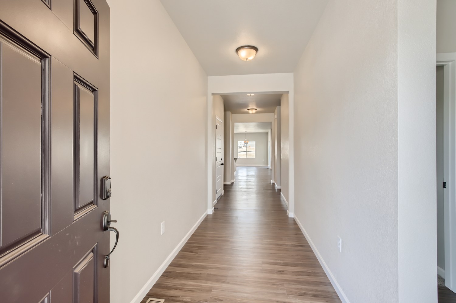 A hallway with white walls.