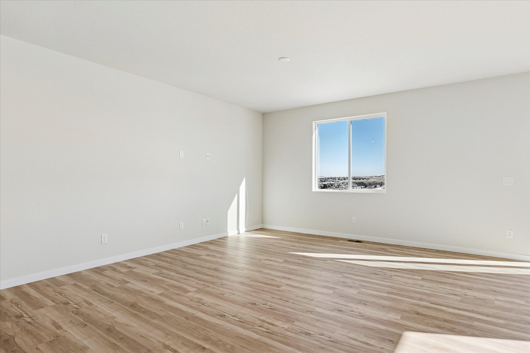 A room with a wood floor and a wood floor.