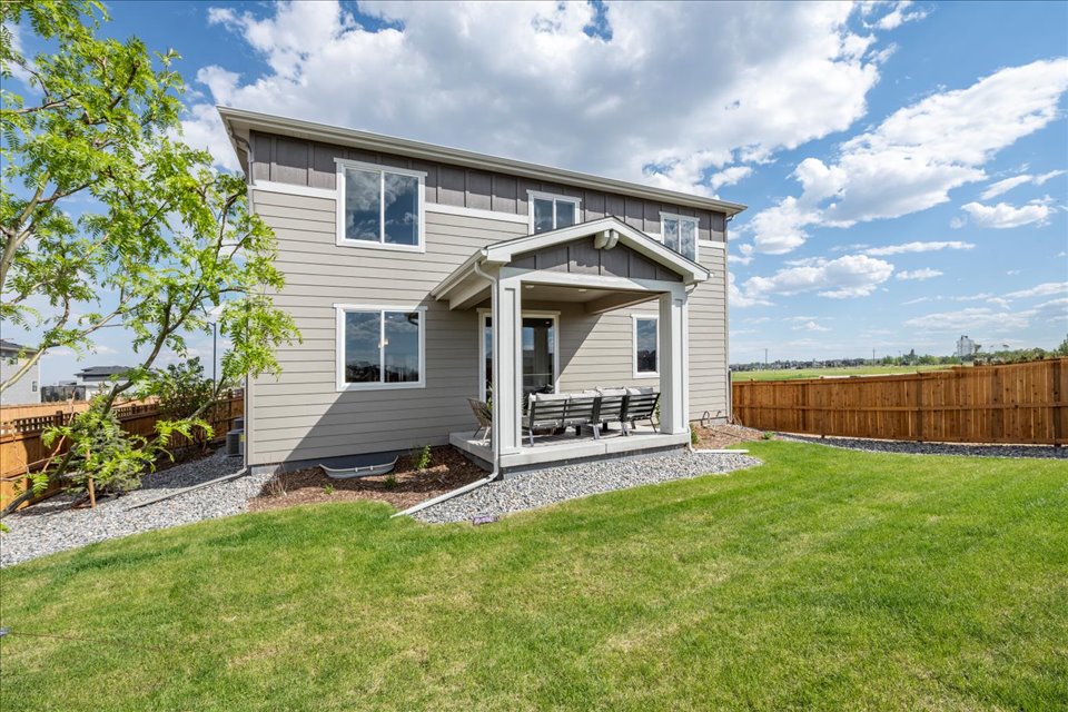 A house with a fence and a yard.