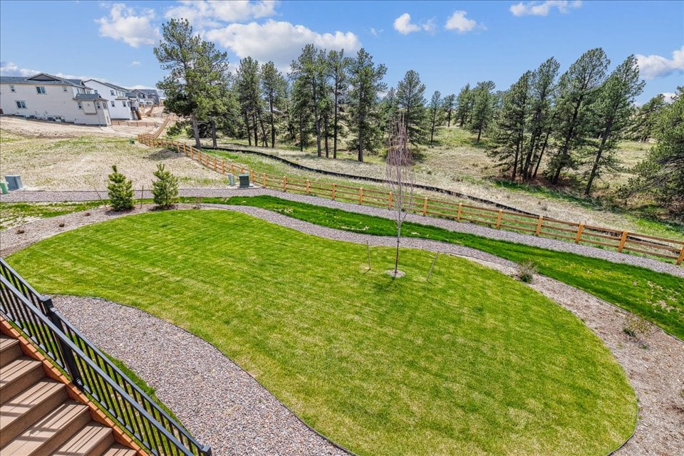 A golf course with a fence.