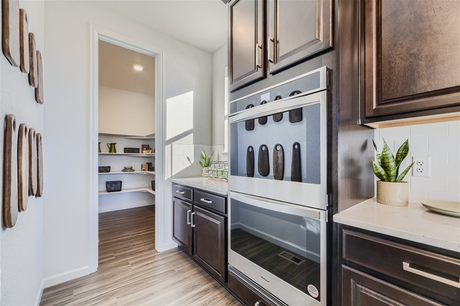 A kitchen with black cabinets.