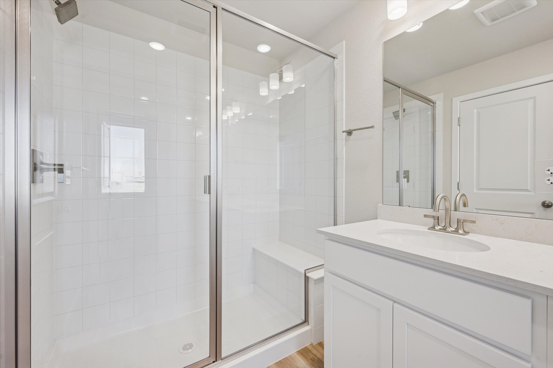 A bathroom with a glass shower.