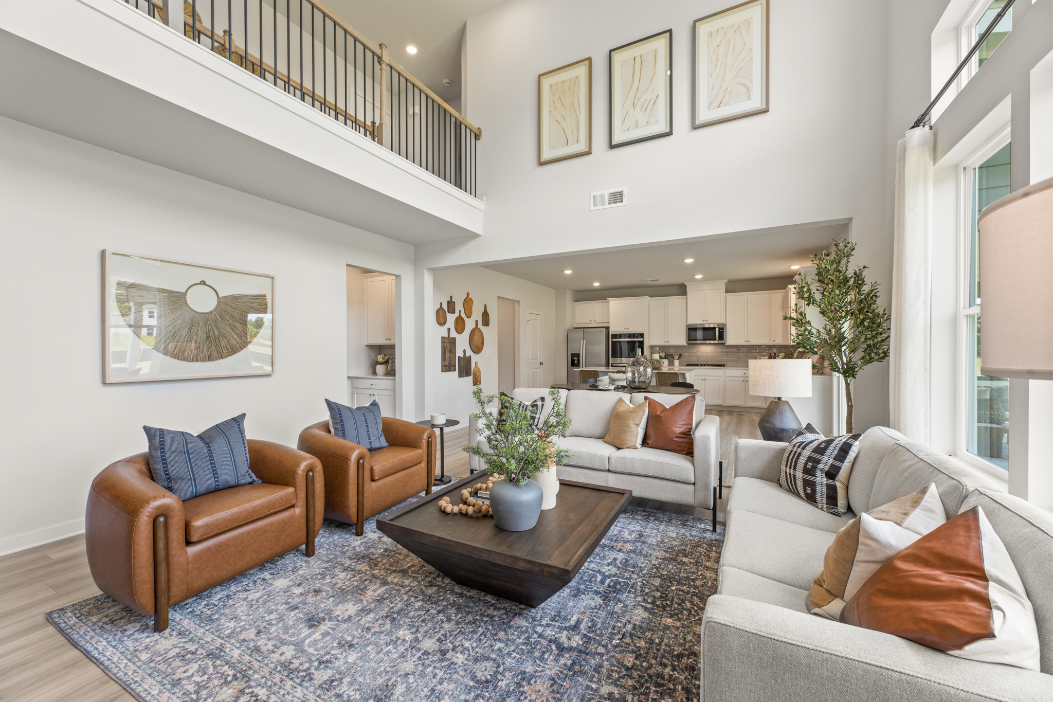 A living room with a couch and chairs.