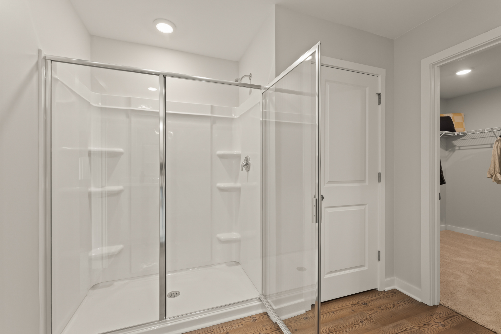 A bathroom with a glass shower.