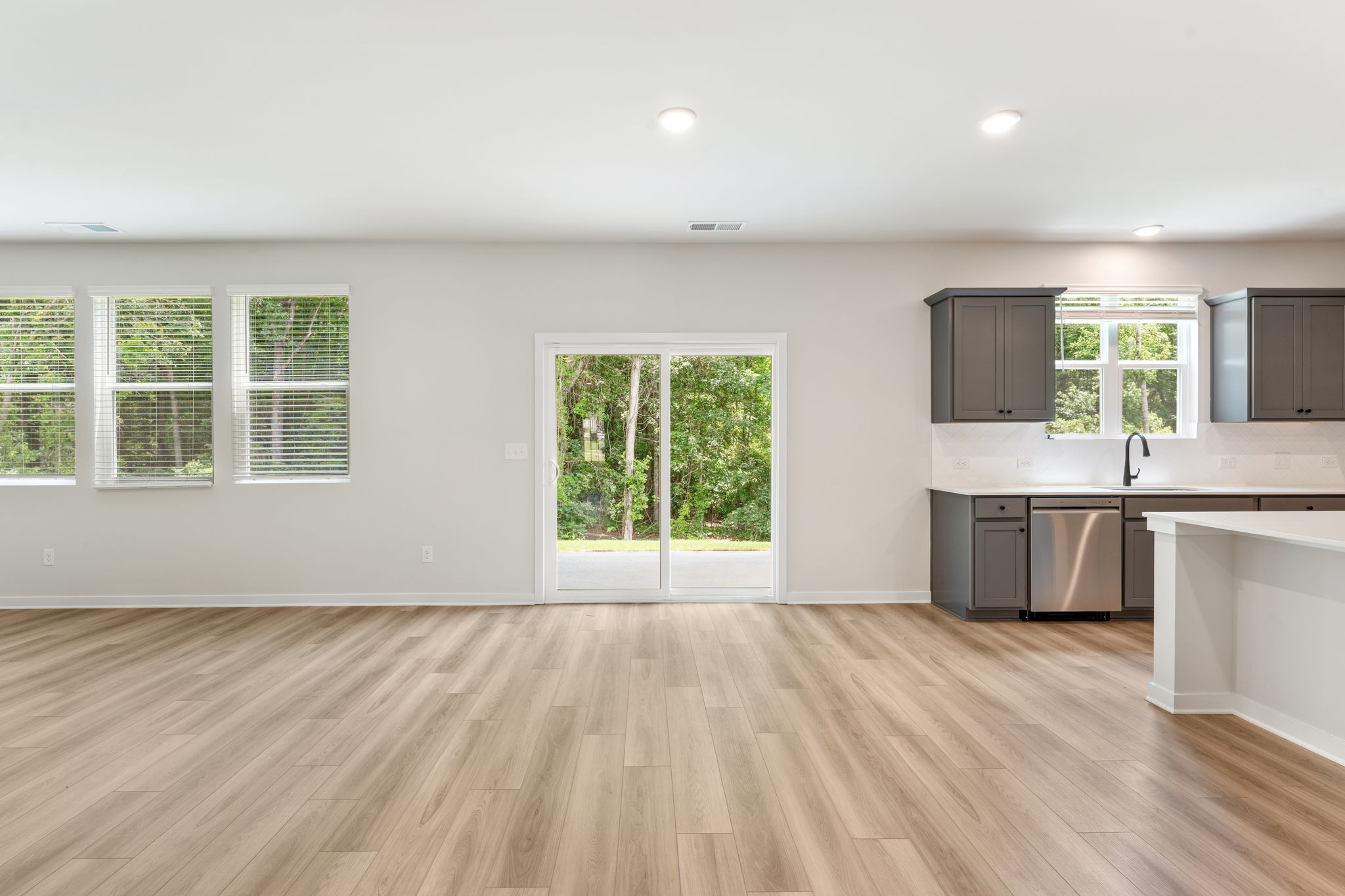 A kitchen with white walls.