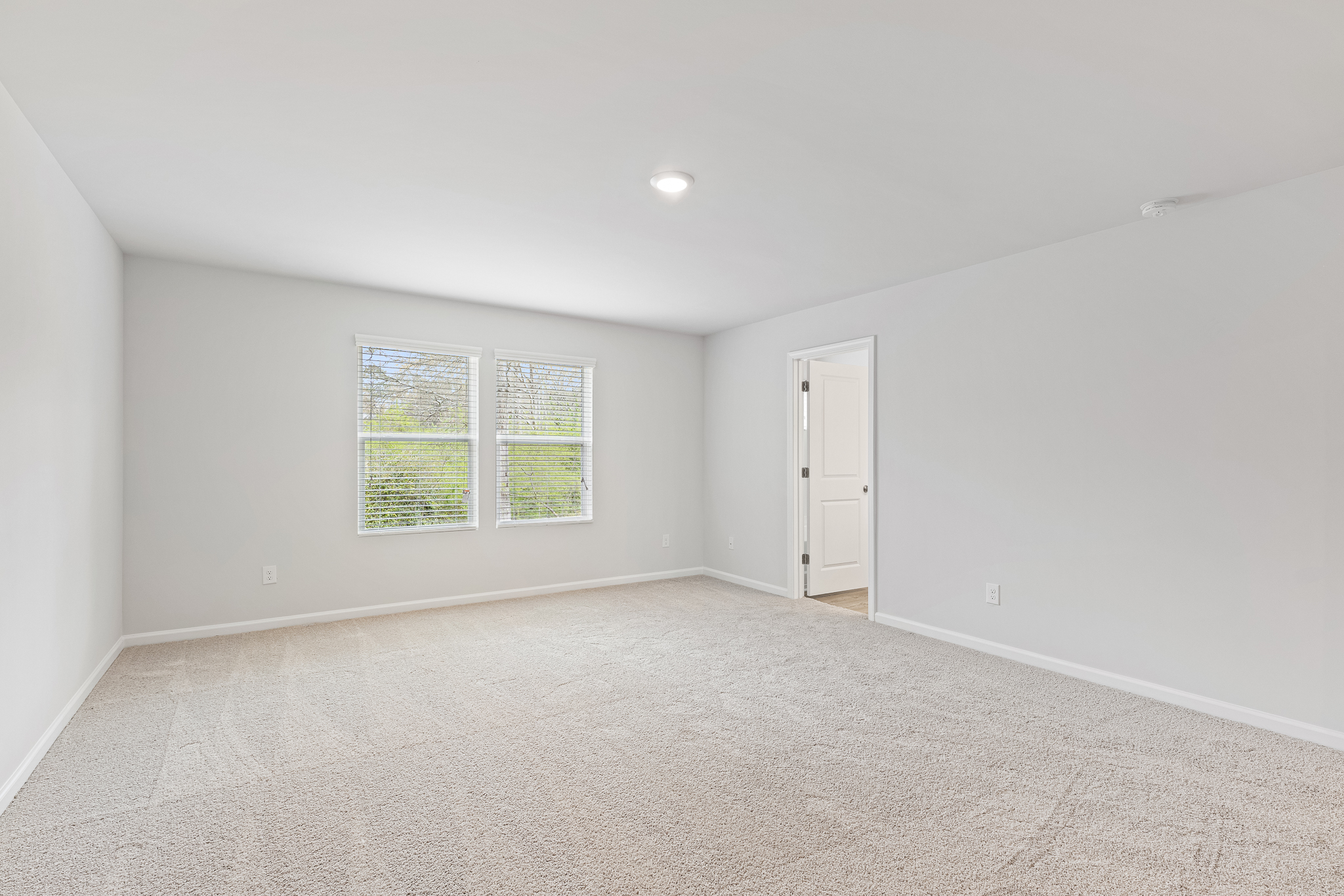 A room with a door and windows.