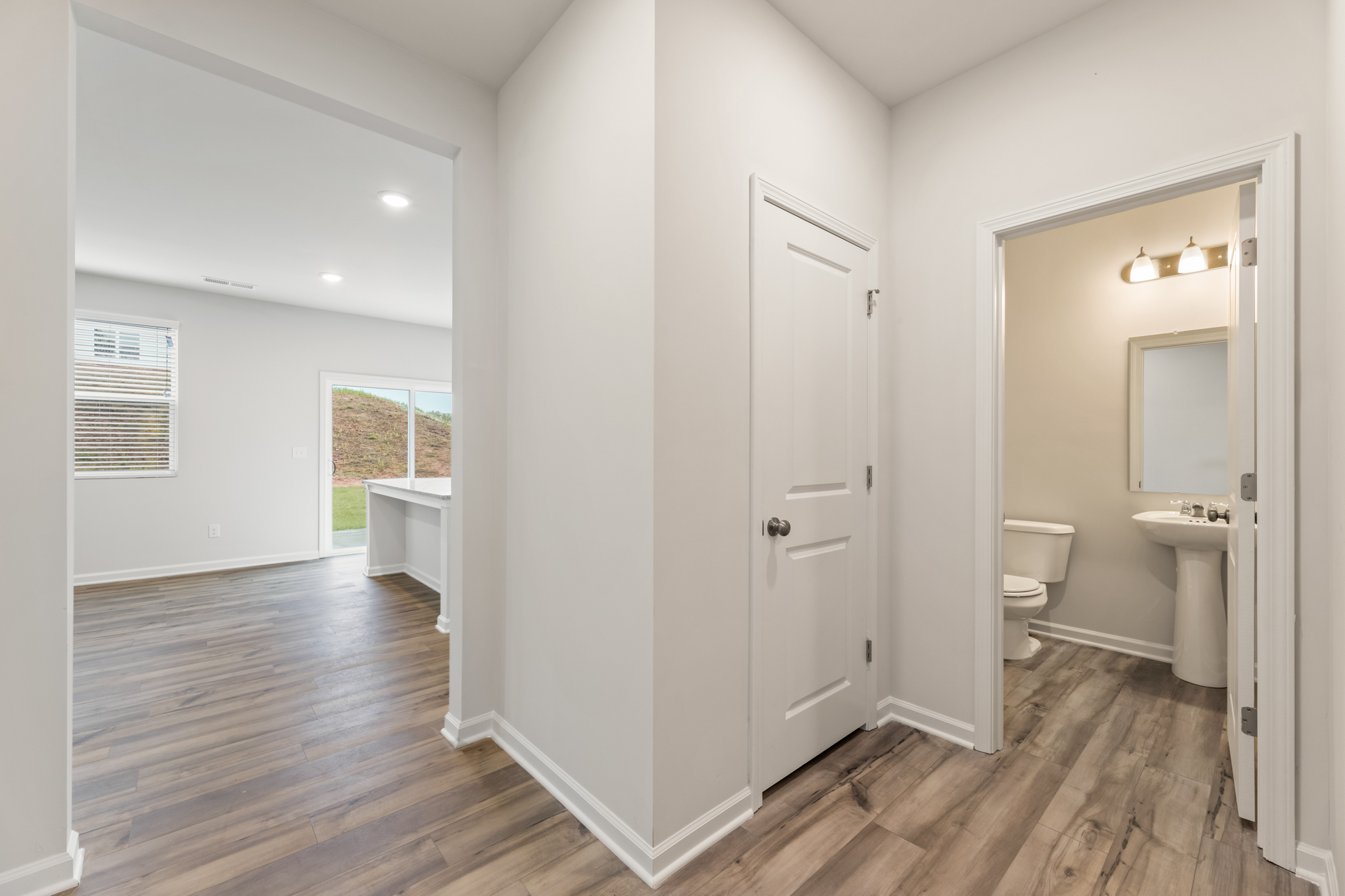 A bathroom with a wood floor.