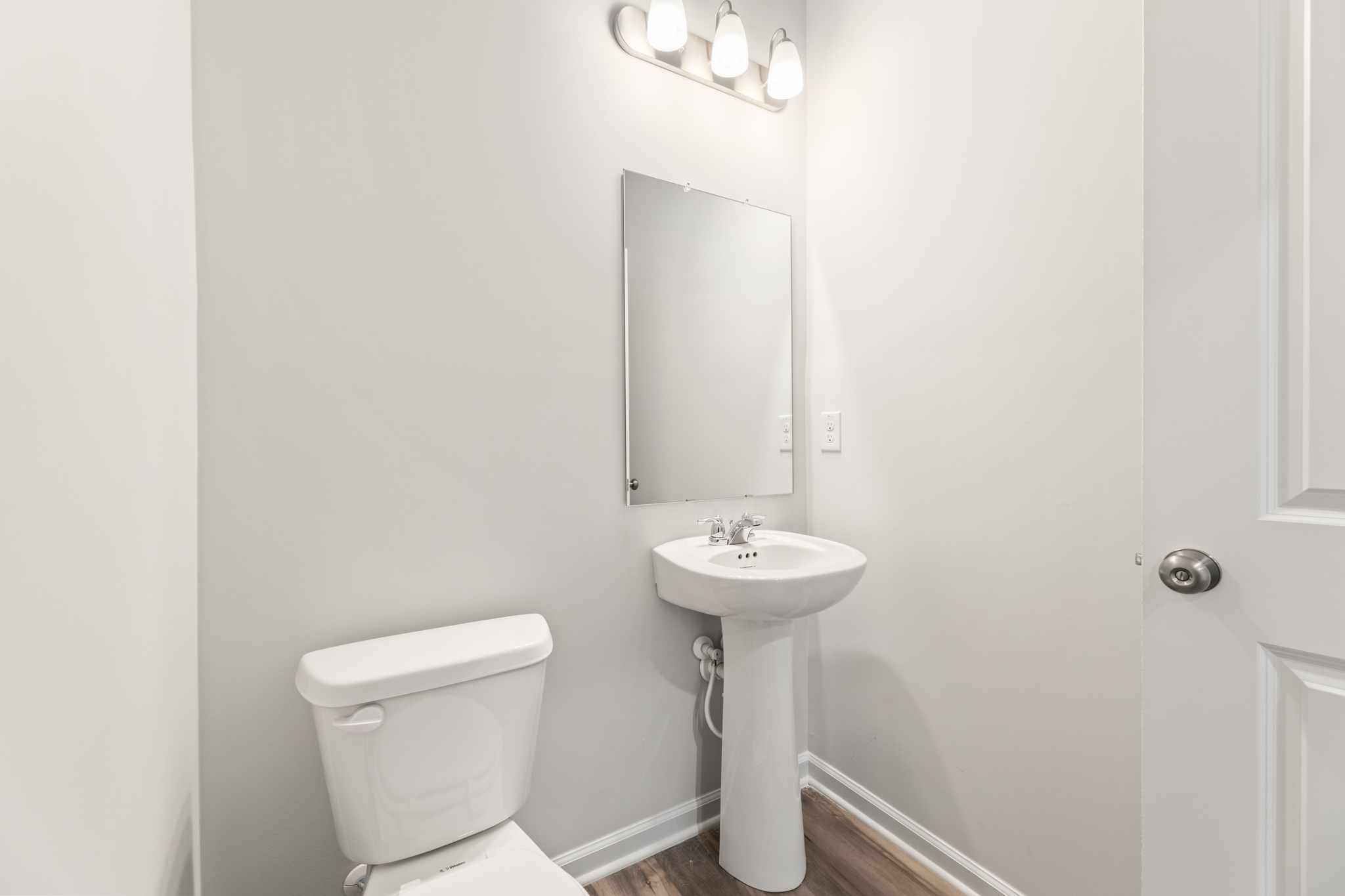 A bathroom with a sink and toilet.