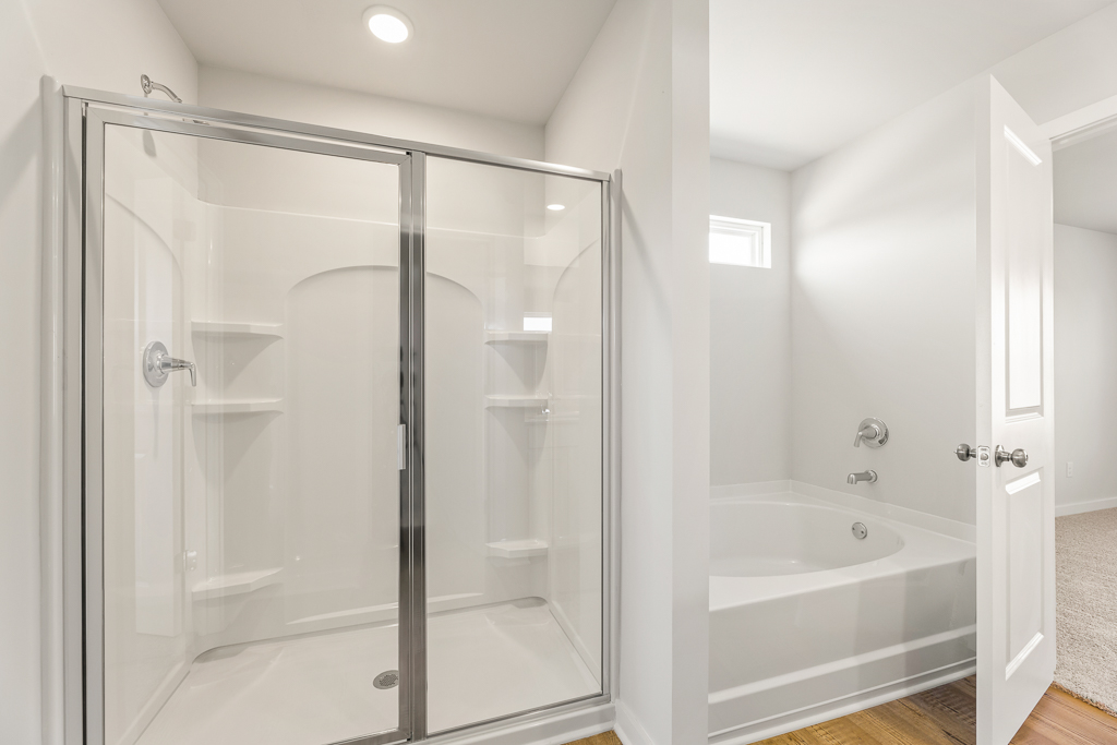 A bathroom with a glass shower.