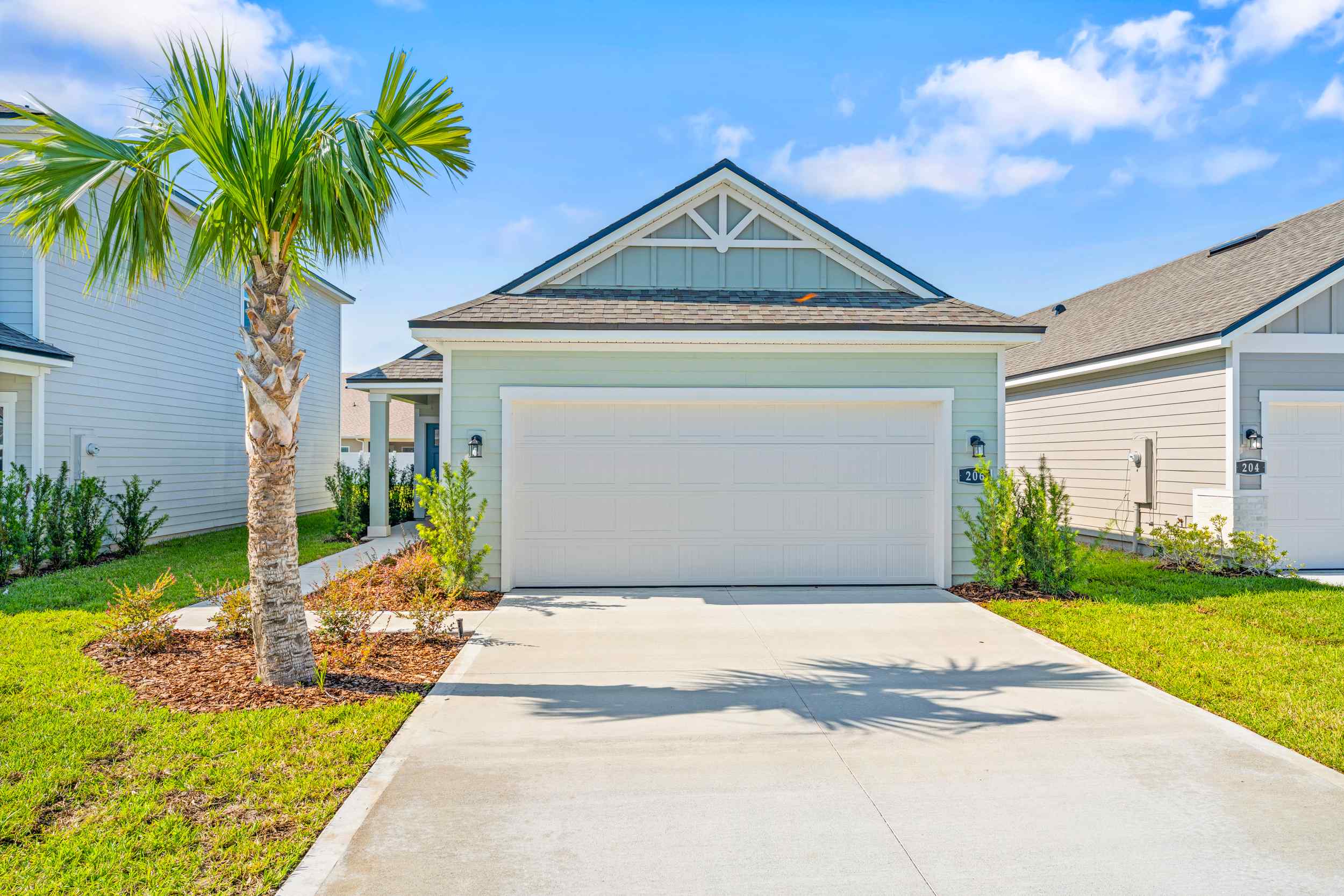 A driveway leading to a house.
