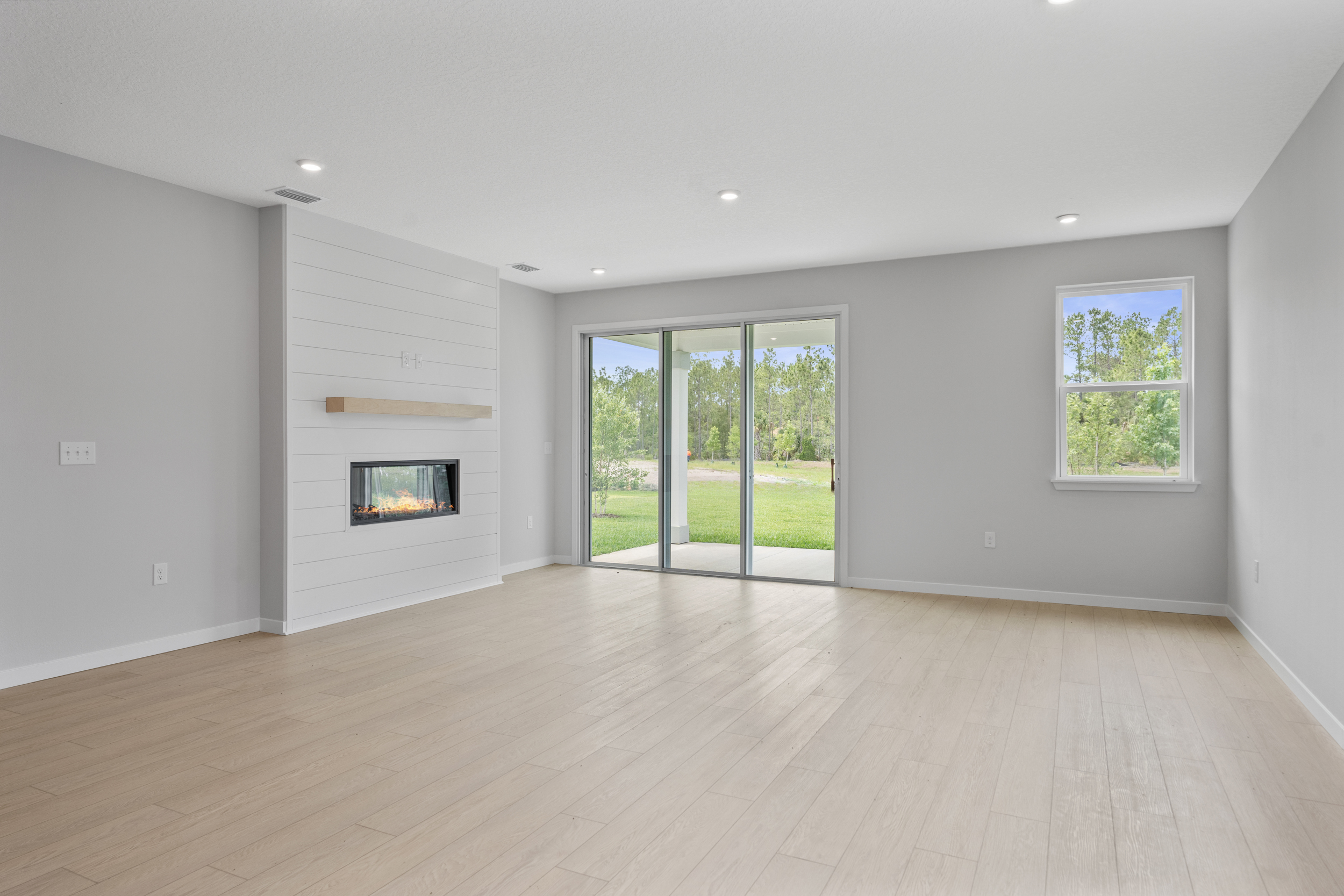 Charleston II Floorplan Lot 50 Great Room with Fireplace at Seminole Palms in Palm Coast