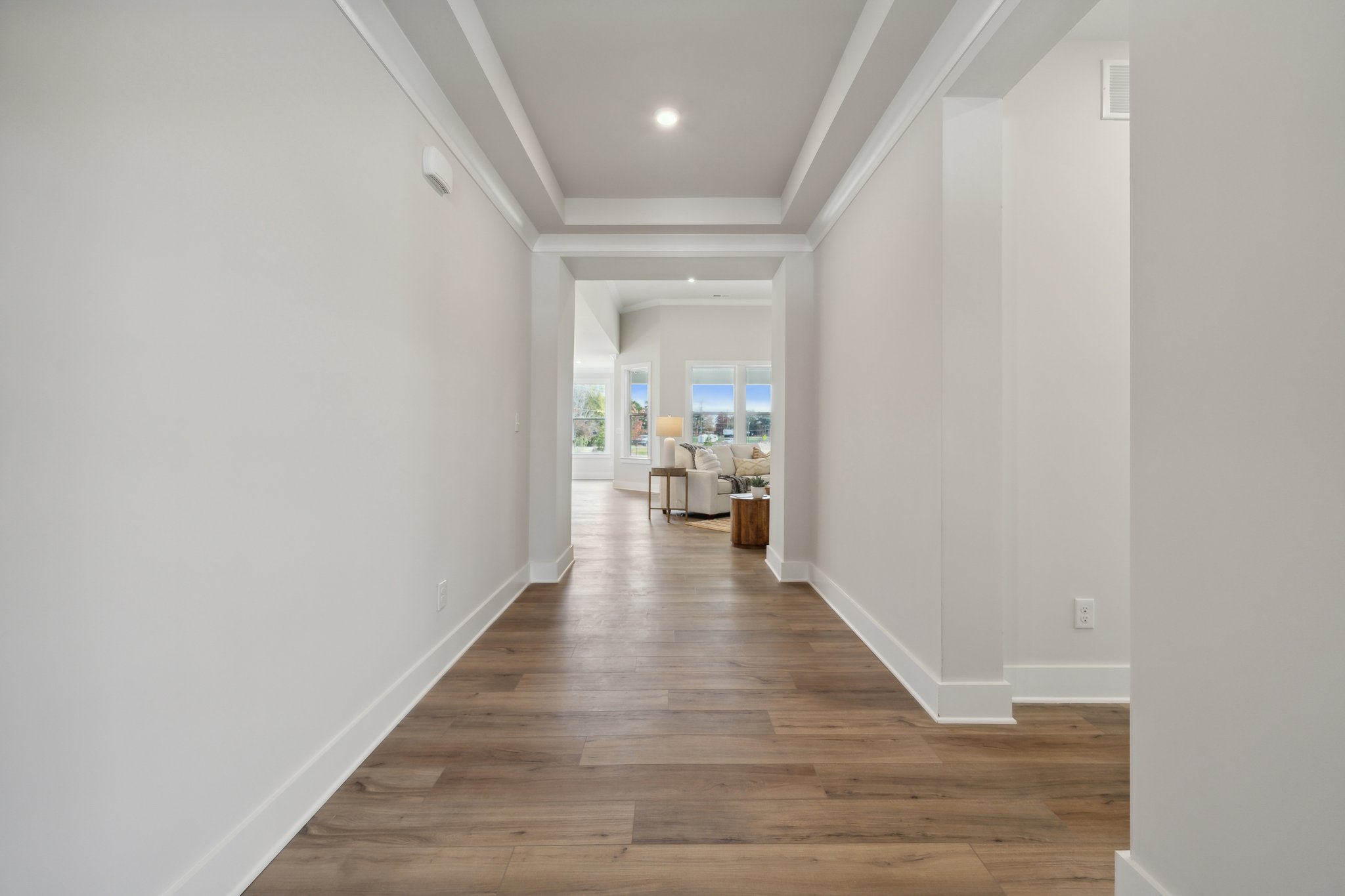 A long hallway with white walls.