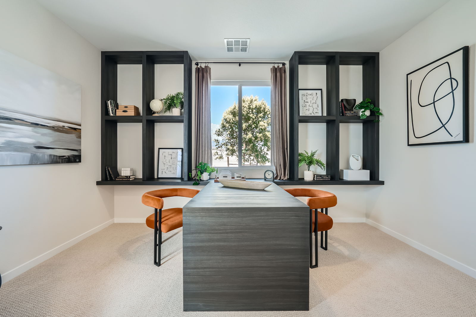 A room with a table and chairs.