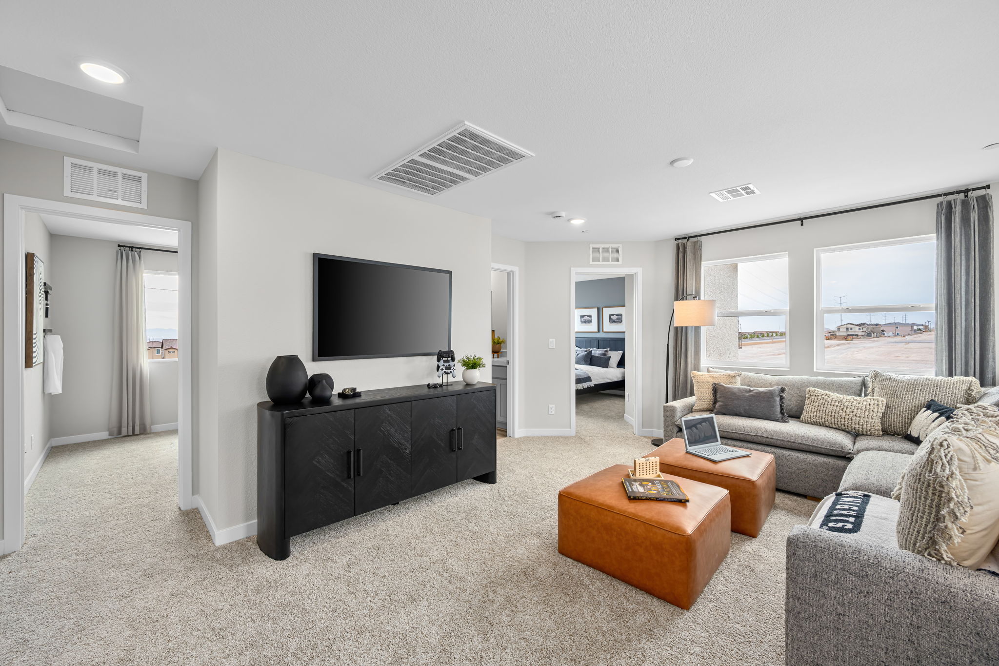 A living room with a tv and couches.