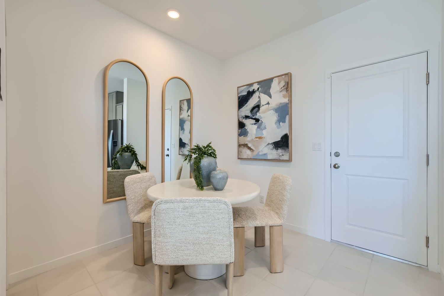 A room with a table and chairs.