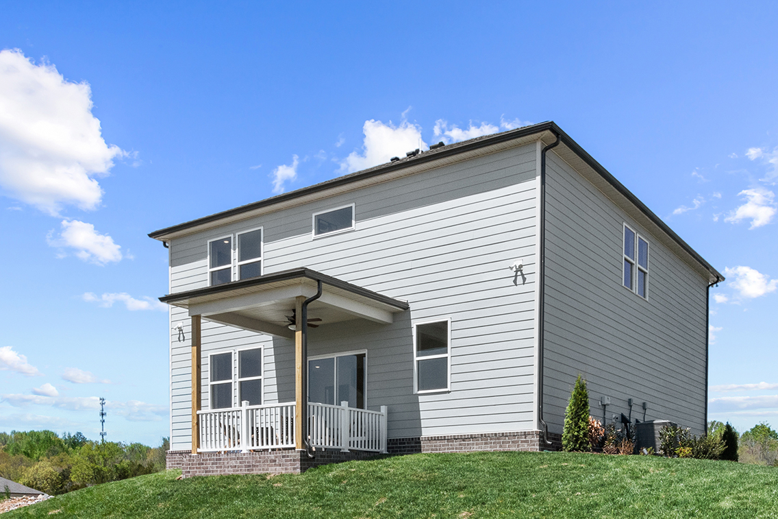 A house with a grass yard.