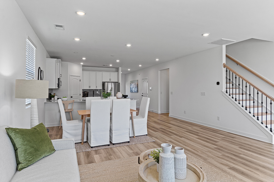 A large kitchen with a dining table.
