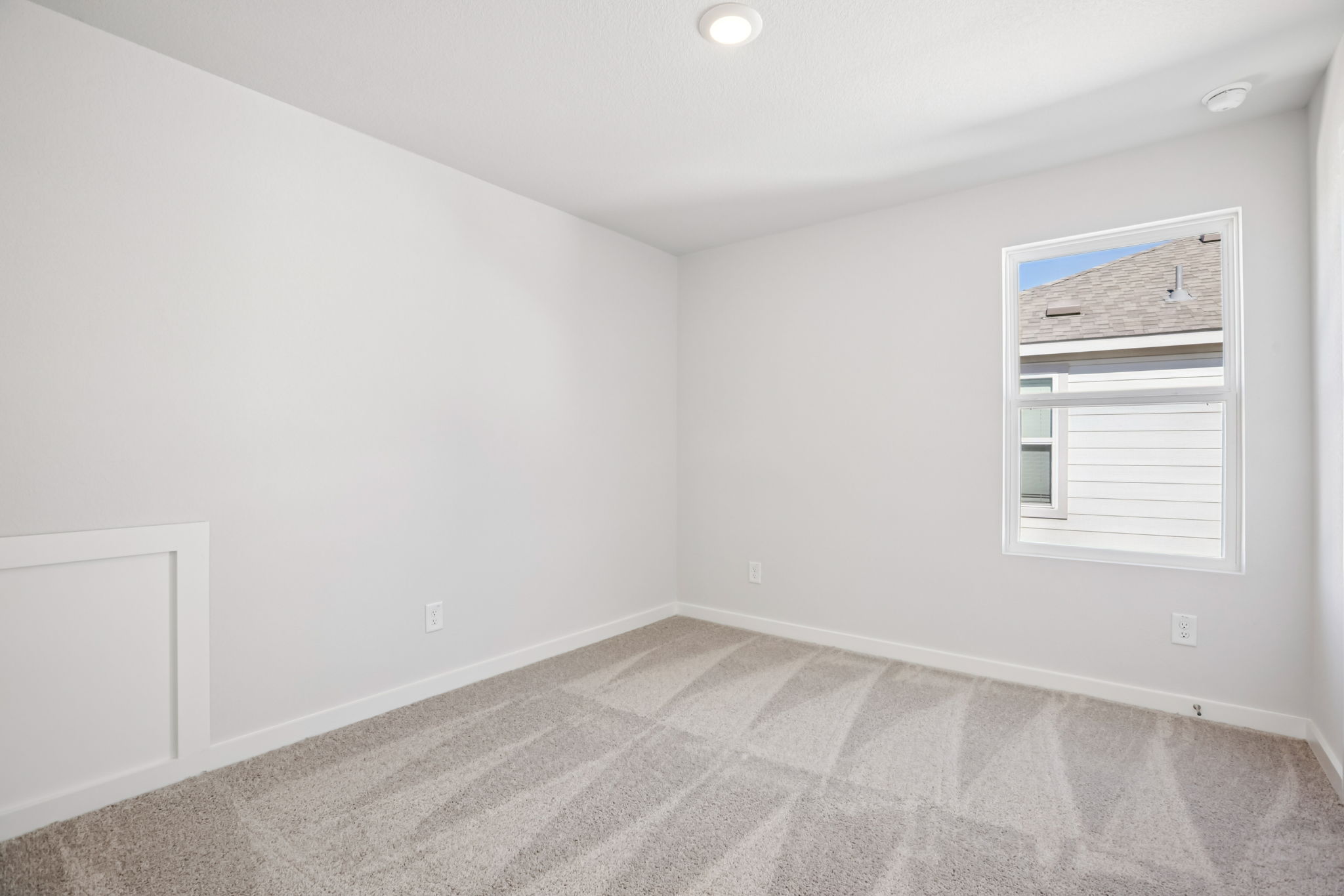 A room with a tile floor and a window.