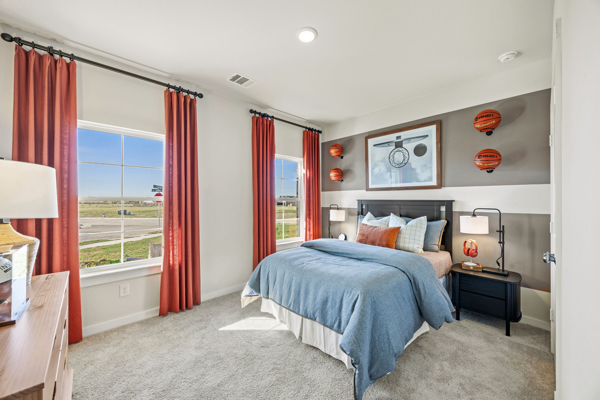 A bedroom with a bed and a window.