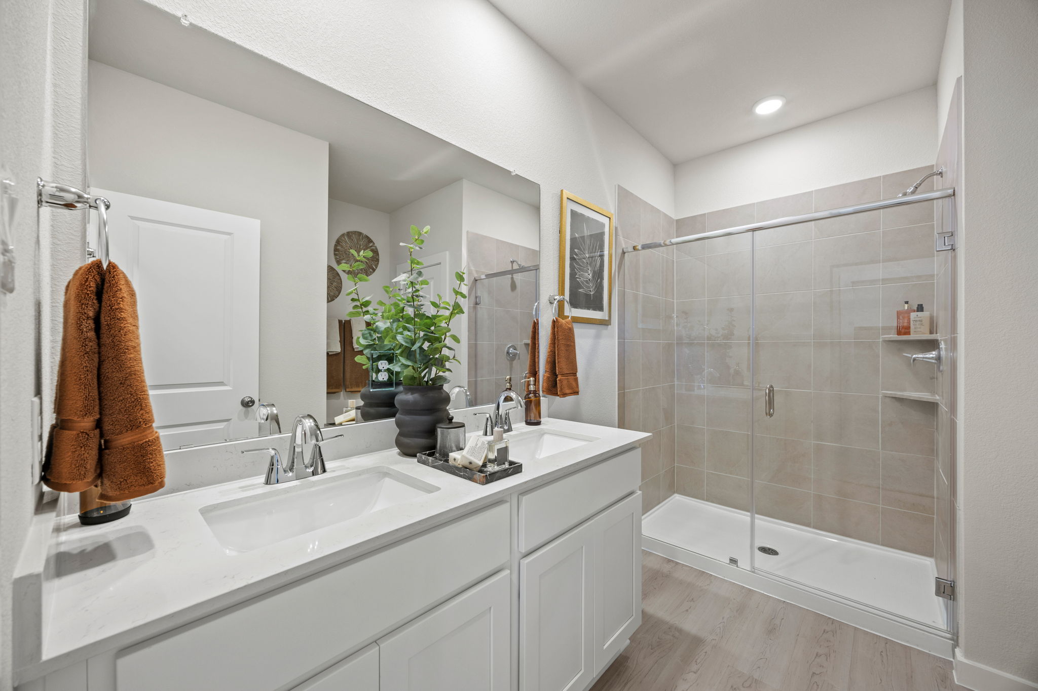 A bathroom with a glass shower.