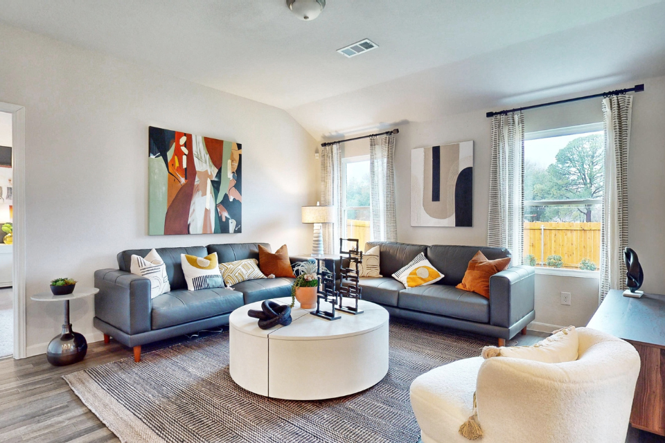 A living room with a couch and a coffee table.