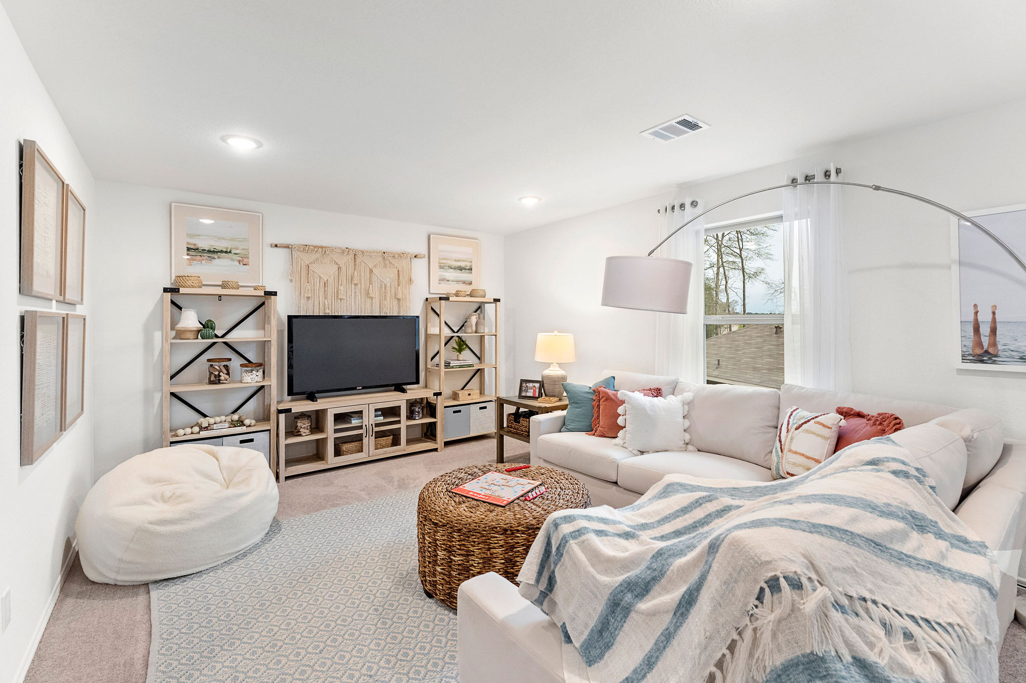 A bedroom with a bed and a tv.