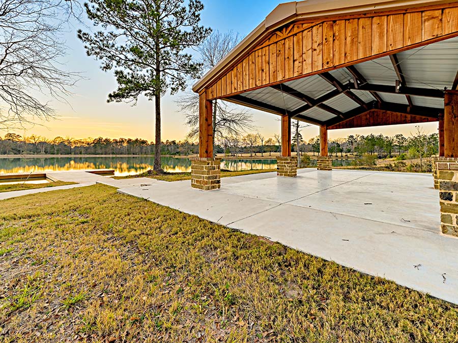 A wooden bridge over a pond.